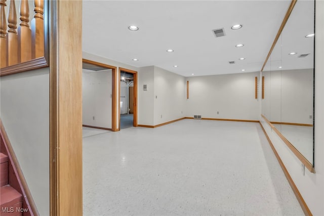 below grade area featuring recessed lighting, visible vents, and baseboards