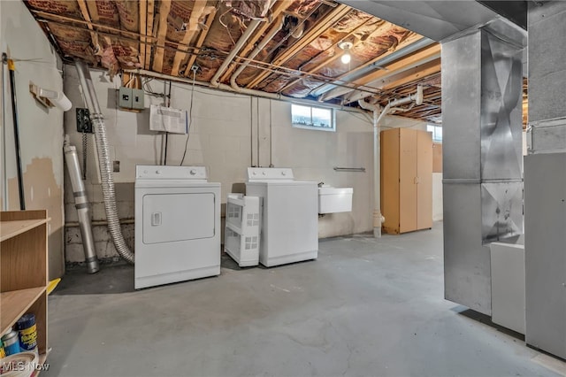 below grade area with washing machine and dryer and a sink