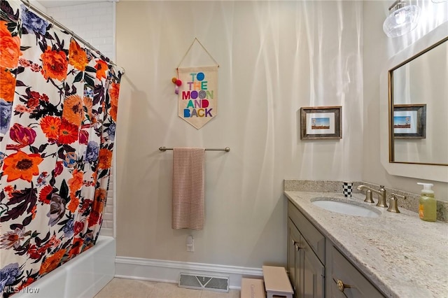 full bathroom featuring visible vents, baseboards, shower / tub combo, tile patterned floors, and vanity