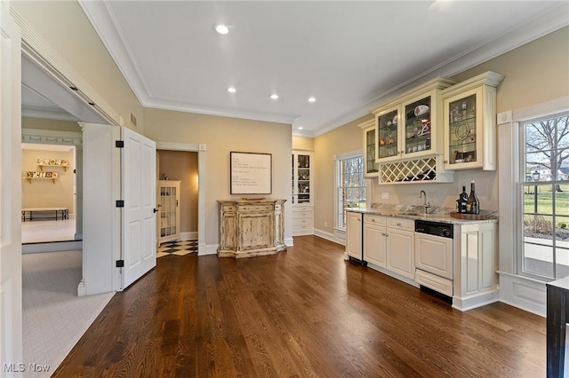 bar featuring ornamental molding, recessed lighting, paneled dishwasher, wet bar, and dark wood-style floors