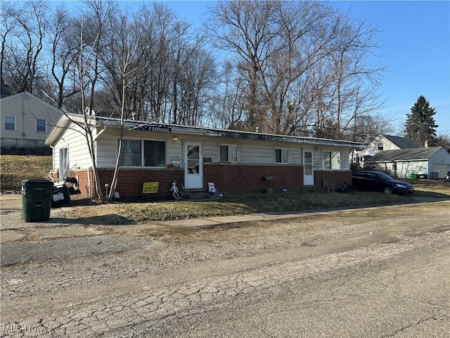 view of front of property with brick siding and entry steps