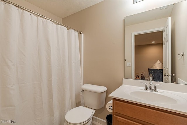 full bathroom featuring vanity and toilet