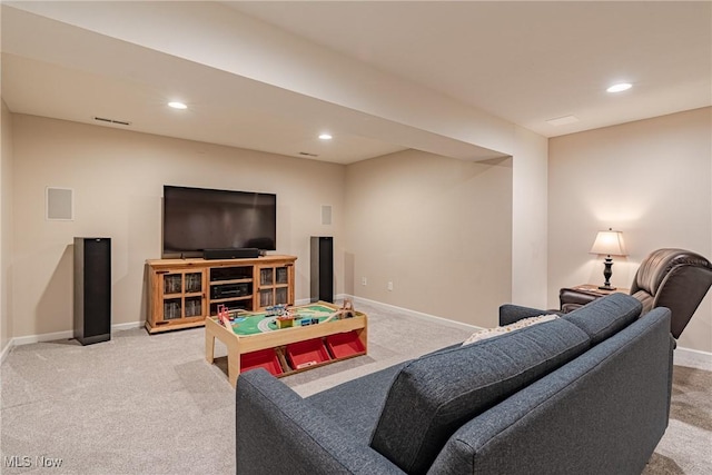 living room featuring recessed lighting, baseboards, and carpet