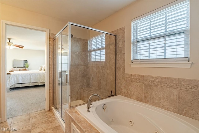 ensuite bathroom featuring tile patterned floors, a ceiling fan, a jetted tub, ensuite bath, and a shower stall