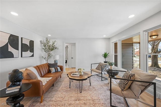 living room with recessed lighting and light wood finished floors