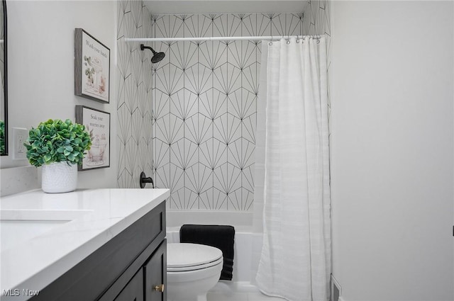 full bathroom with toilet, vanity, and shower / bath combination with curtain