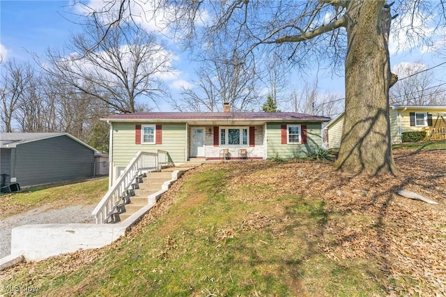 single story home with a chimney