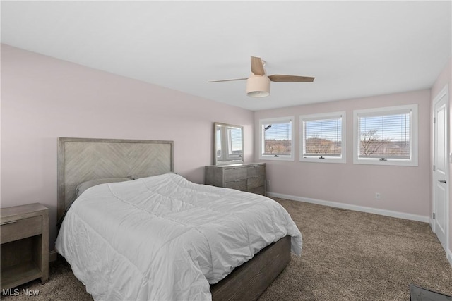 bedroom with baseboards, ceiling fan, and carpet flooring