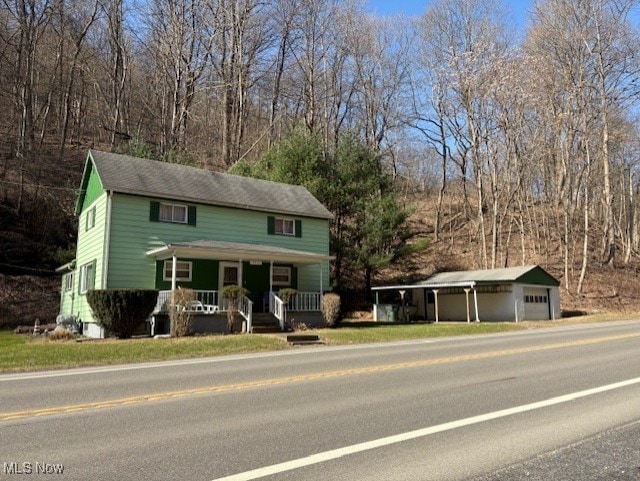 view of front of house with an outbuilding and covered porch