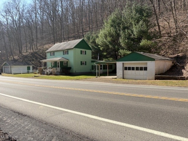 view of front of property with an outbuilding and a garage