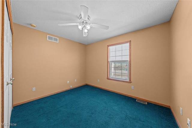 unfurnished room featuring visible vents, ceiling fan, baseboards, and carpet