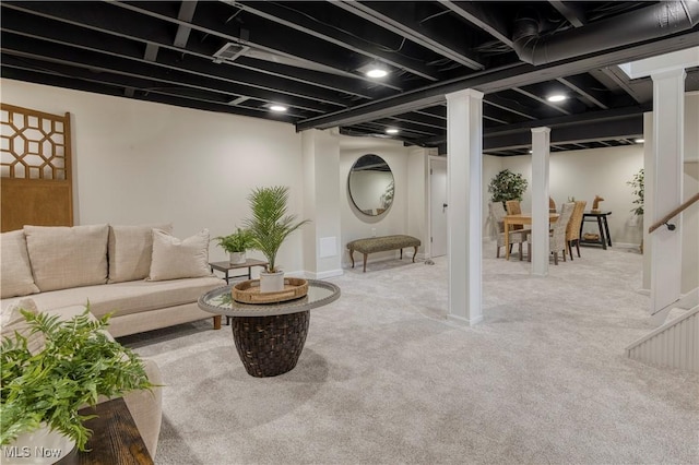 living area featuring baseboards and carpet flooring