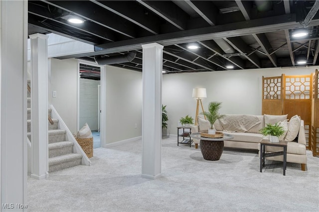 finished basement featuring stairs, baseboards, and carpet floors