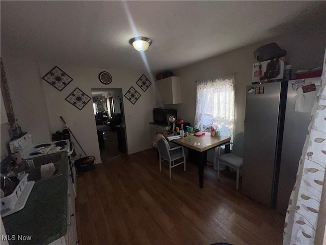 dining area with wood finished floors