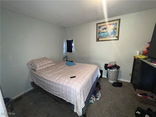 carpeted bedroom featuring baseboards