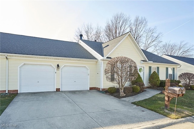 single story home featuring concrete driveway, a garage, and roof with shingles