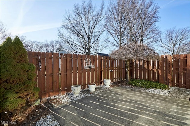 wooden terrace featuring fence