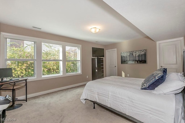 bedroom with visible vents, carpet flooring, and baseboards