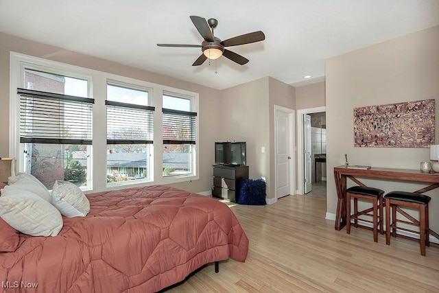 bedroom featuring recessed lighting, a ceiling fan, light wood-type flooring, and baseboards