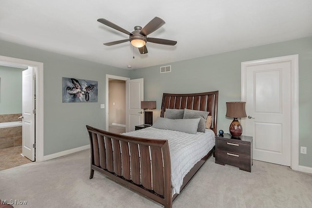 bedroom featuring visible vents, light carpet, and baseboards