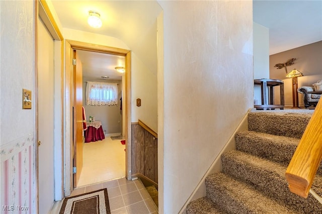 staircase with tile patterned floors