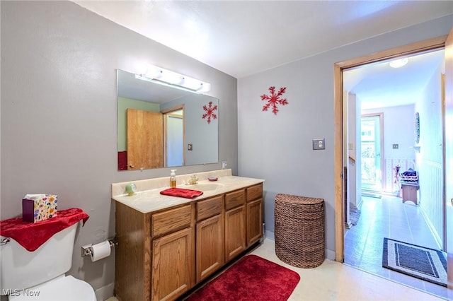 bathroom featuring vanity and toilet