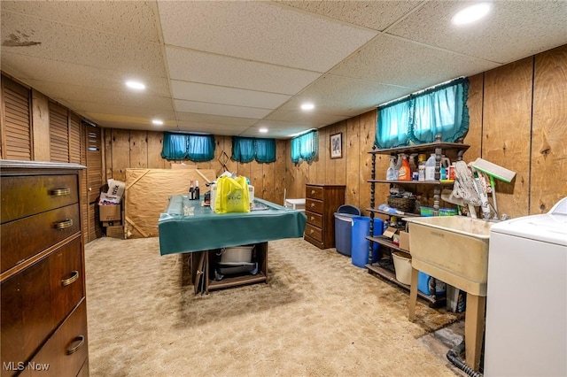 rec room with a drop ceiling, washer / clothes dryer, recessed lighting, wooden walls, and carpet flooring