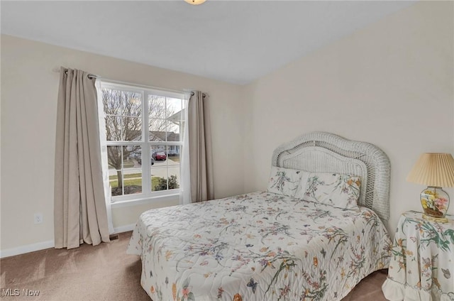 carpeted bedroom with baseboards