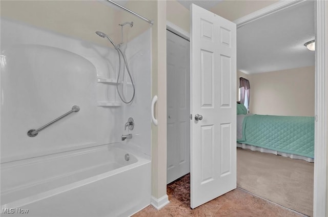 bathroom with tile patterned floors, shower / bath combination, and ensuite bath