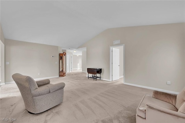 living room with light carpet, baseboards, and vaulted ceiling