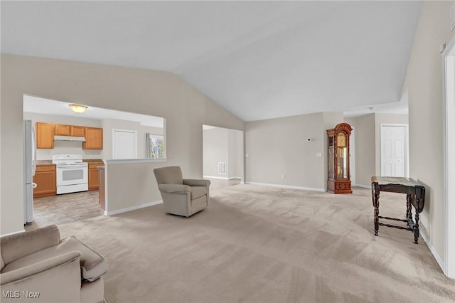 living area featuring baseboards, light colored carpet, and vaulted ceiling