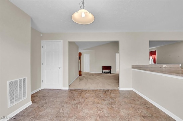 empty room with baseboards and visible vents