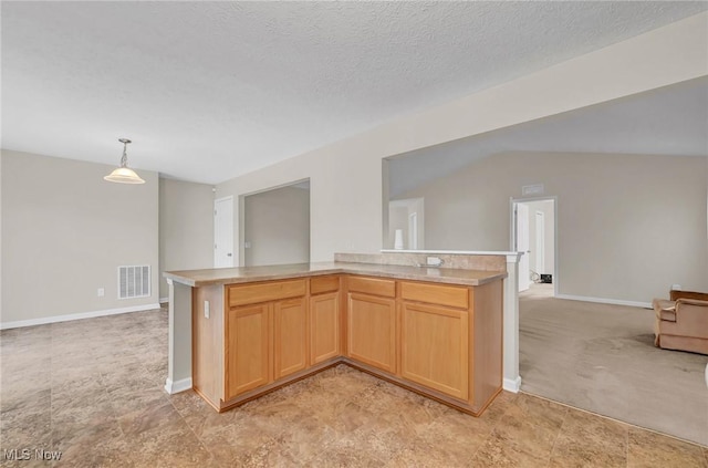 kitchen with visible vents, baseboards, open floor plan, light countertops, and a textured ceiling