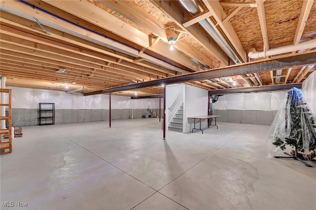 unfinished basement with stairs