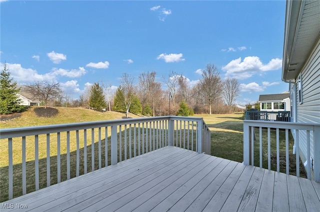 wooden deck with a yard