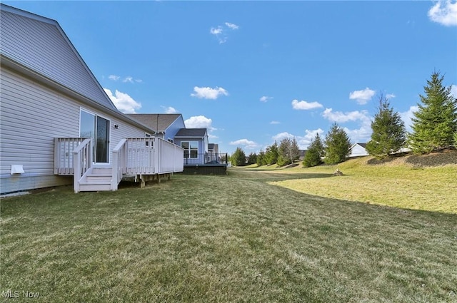 view of yard with a deck