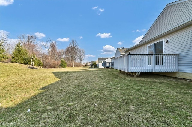 view of yard with a deck