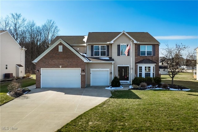 view of front facade featuring driveway, brick siding, and a front lawn