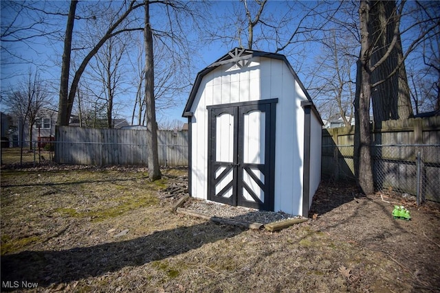 view of shed with a fenced backyard