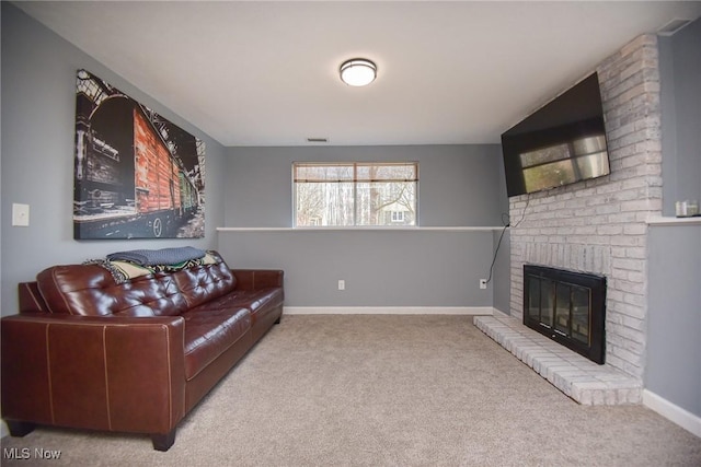 carpeted living area featuring a brick fireplace, visible vents, and baseboards