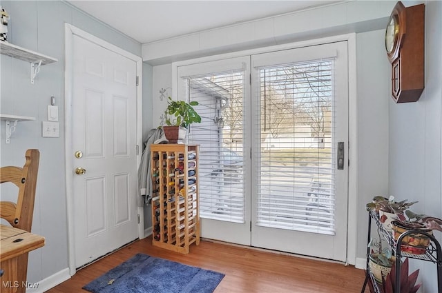 doorway with wood finished floors