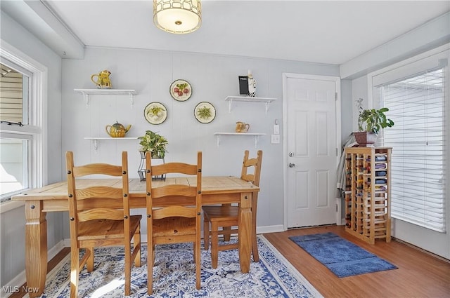 dining space featuring light wood-type flooring