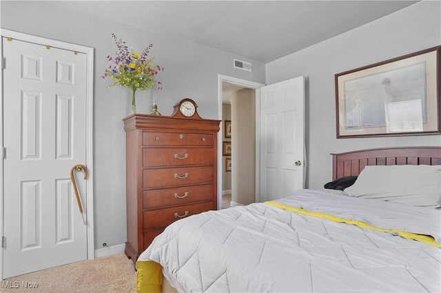 bedroom with visible vents and carpet floors