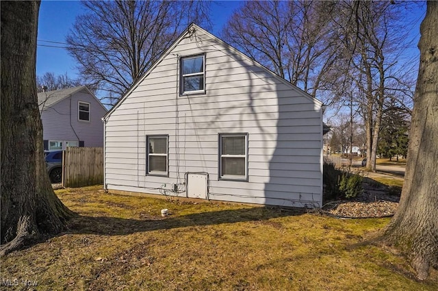 rear view of house with fence