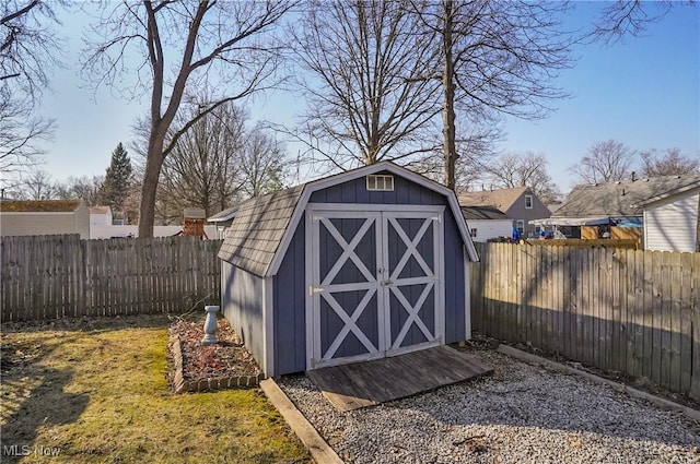 view of shed with a fenced backyard