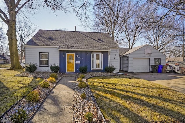 view of front facade featuring concrete driveway, an attached garage, a front yard, and a shingled roof