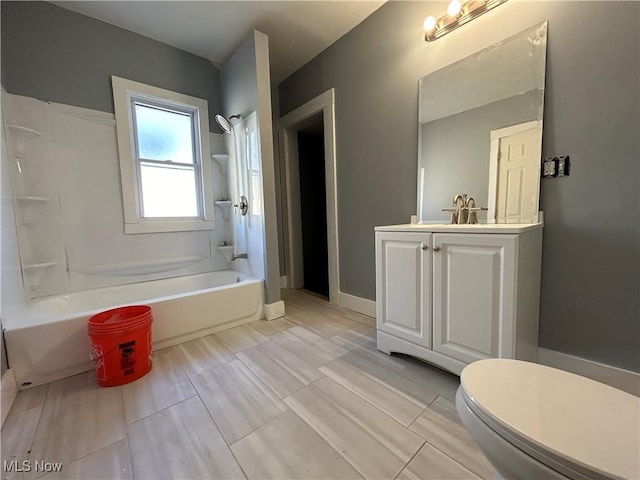 bathroom featuring shower / washtub combination, vanity, and toilet