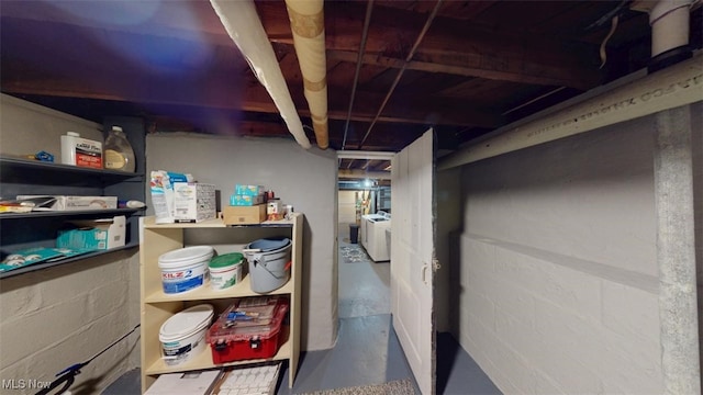 unfinished basement featuring independent washer and dryer