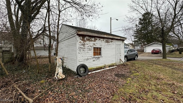 view of home's exterior featuring an outbuilding