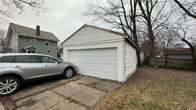 detached garage with fence